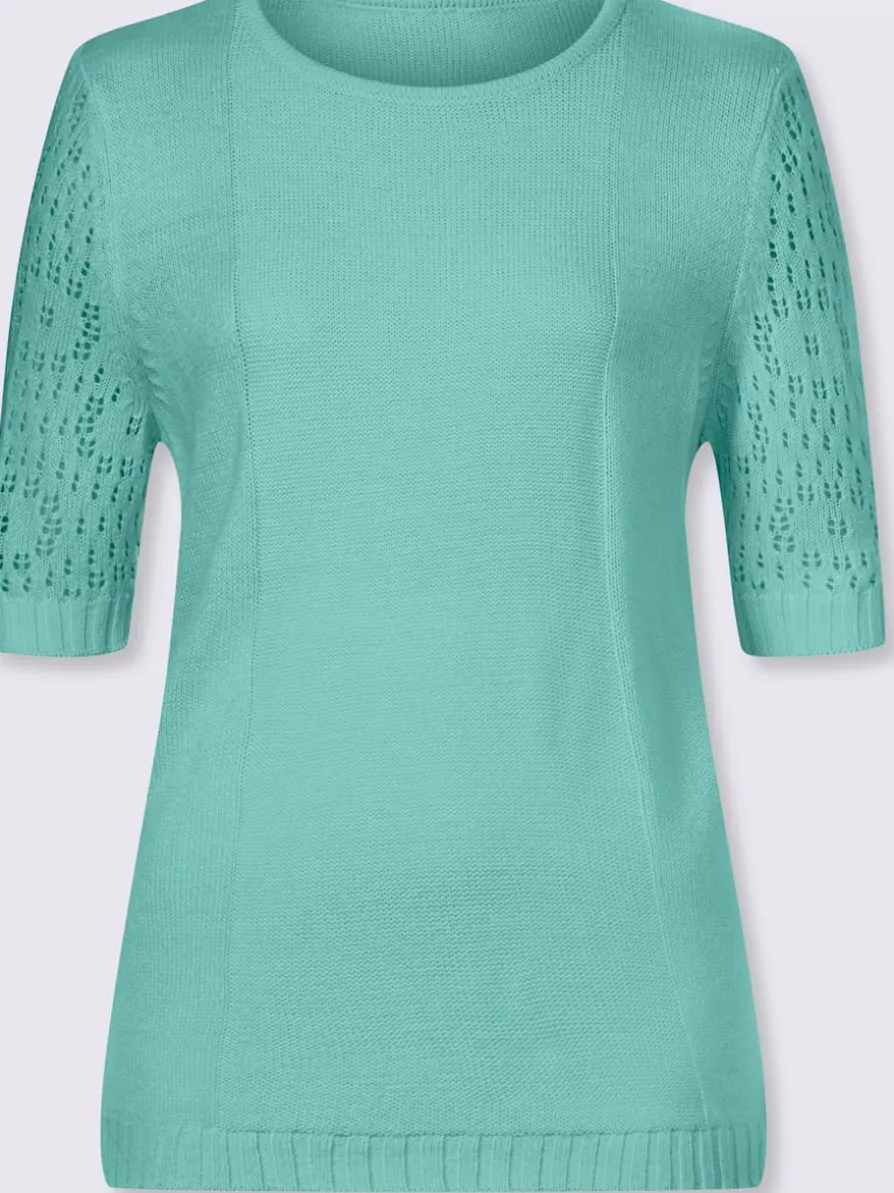 Pull motif ajouré à la manche