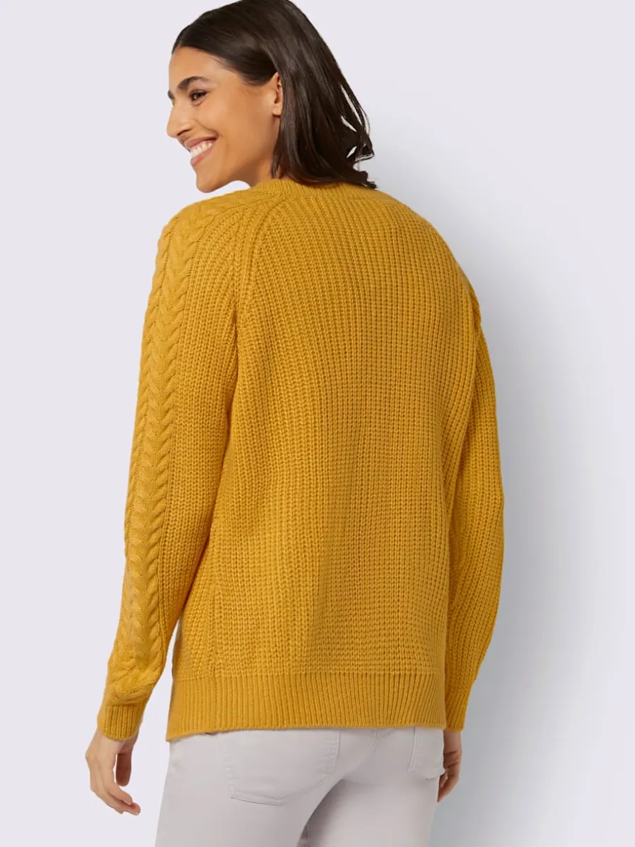 Veste en tricot manches raglan avec joli motif torsadé